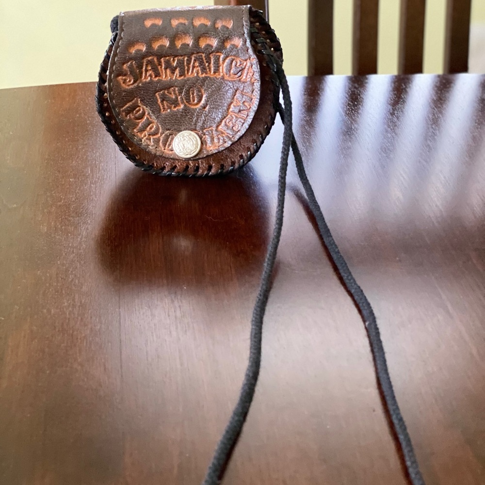 Leather over the shoulder purse/pouch with logo.
